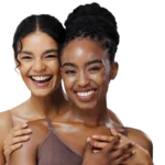 Two smiling women with healthy radiant skin posing together